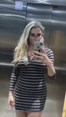 Masturbating her thick cock on an elevator