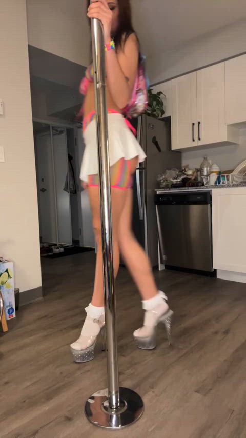 Baby stripper playing around her pole 