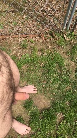 Pissing on my toes completely naked outside. Watch my cock grow at the end as I jerk