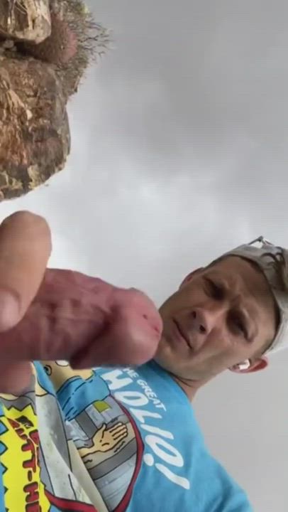 Man climbs a mountain to shoot a load of jizz in his mouth