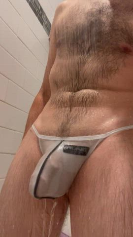 Stripping out of a soaking wet thong.