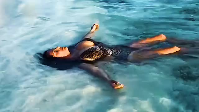 Salma Hayek relaxing in the ocean