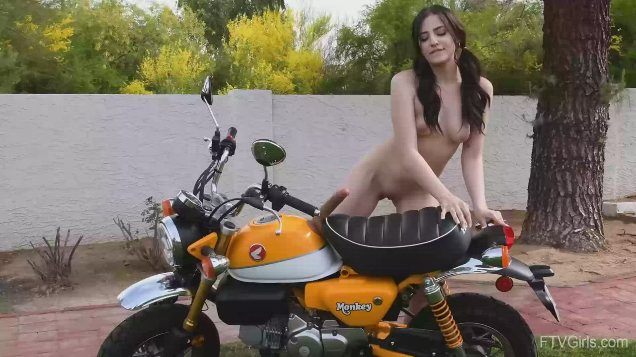 Riding Her Motorbike