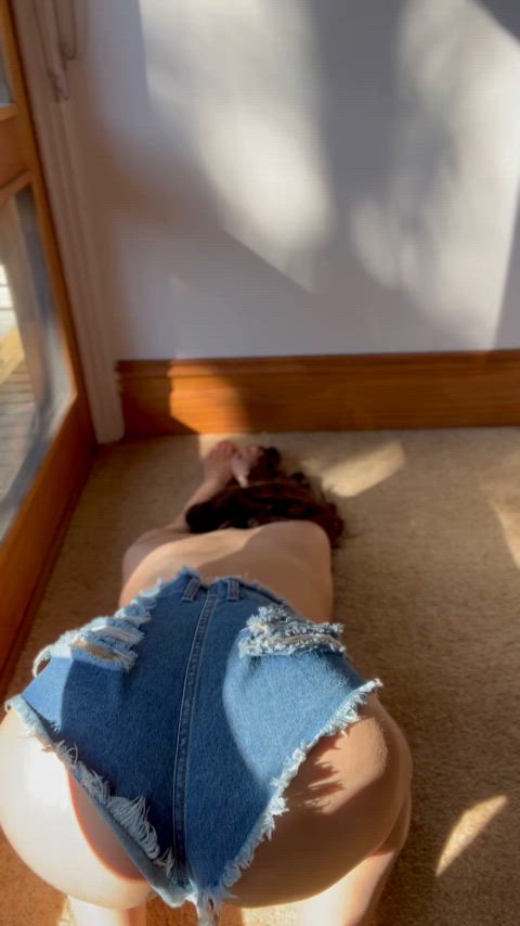 Teasing in my ripped denim shorts 🤤😈