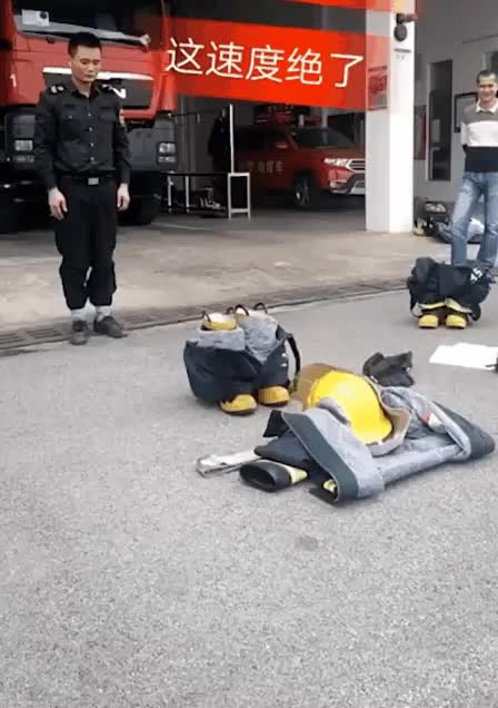 The efficiency of this fireman putting on his gear.