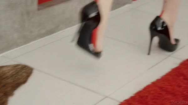 Evelyn Claire in wicked stilettos : walking to mirror