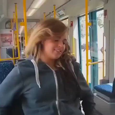 Trying out her new toy on the bus