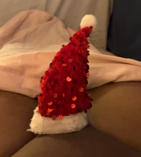 Small black dick in a small red Santa hat