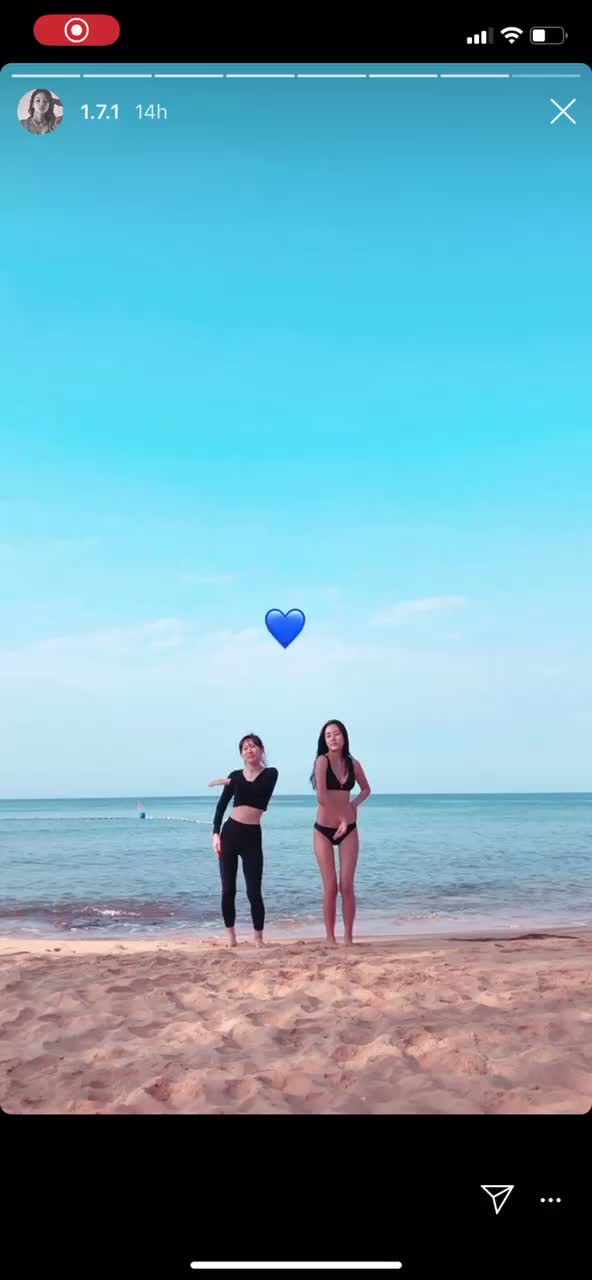 sexy Asian women dancing on the beach in cute and hot black bikinis