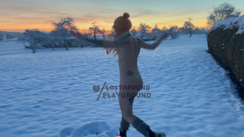 Dancing girl in frozen land with burning sky