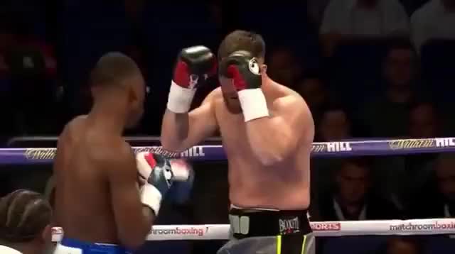 Isaac Chamberlain lands a left hook on Ryan Crawford while he's against the ropes.