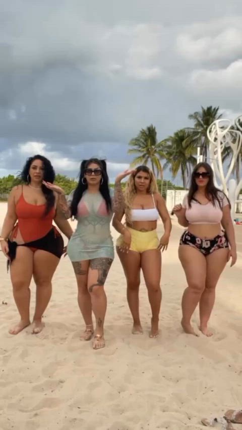 Four big booty models at the beach.