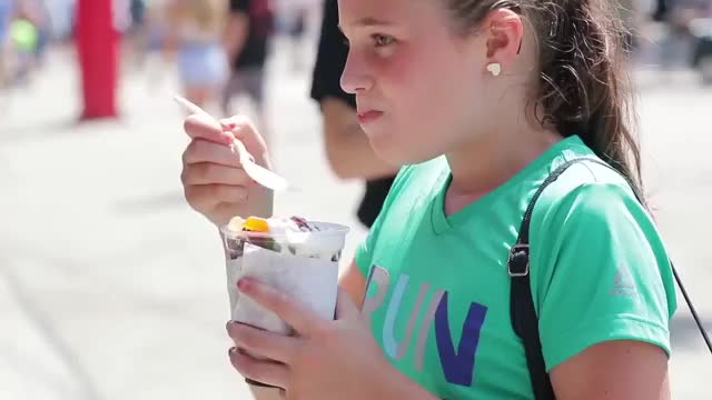 Someone made a reverse video of people eating food at Summerfest.