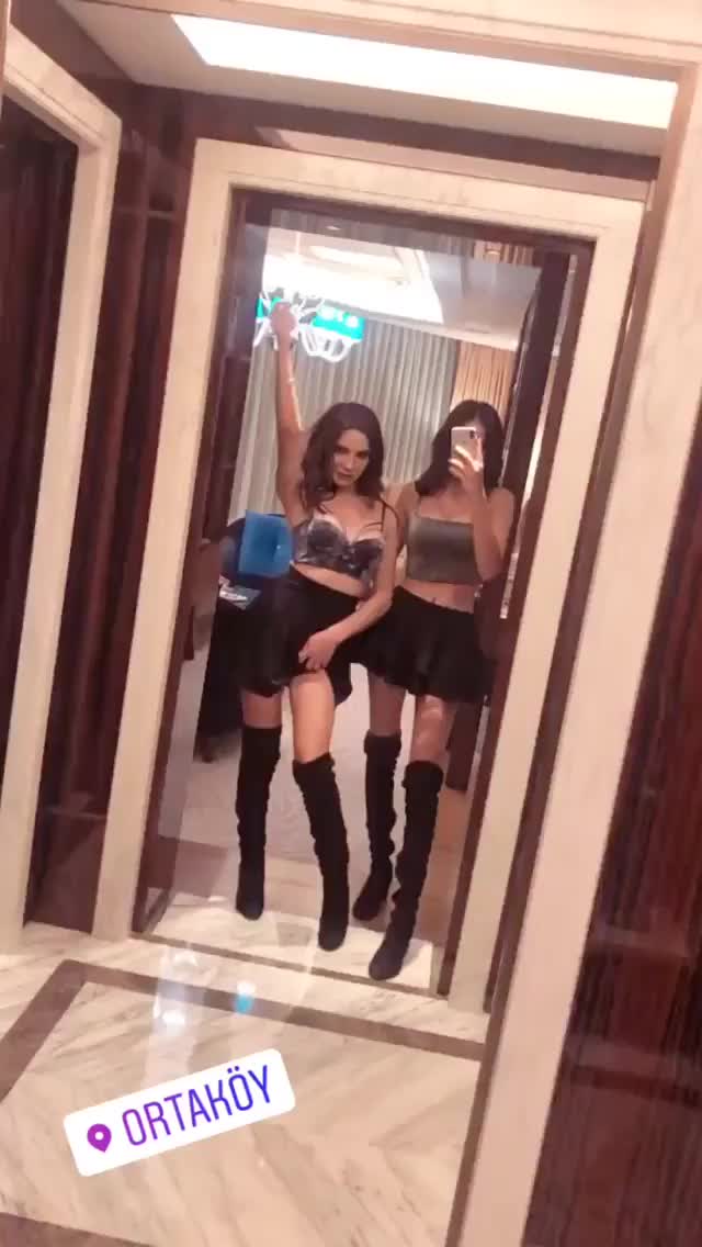 merve taskin with damla posing in front of a mirror
