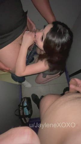 Sucking a stranger's cock at the glory hole sex arcade