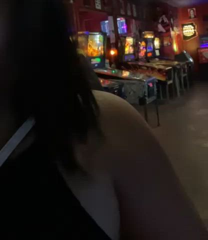 Flashing a tit at the arcade bar with a stranger behind me