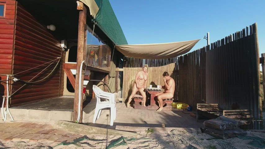 The sun was shining brightly as the naturistfuncouple walked along the beach. They