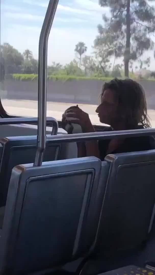 Just a normal guy and his pet rat on a bus