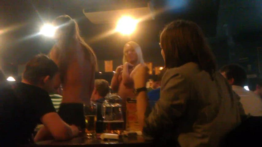 Two girls wearing only panties in the bar