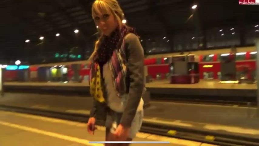Cute German girl leaves a puddle on station platform