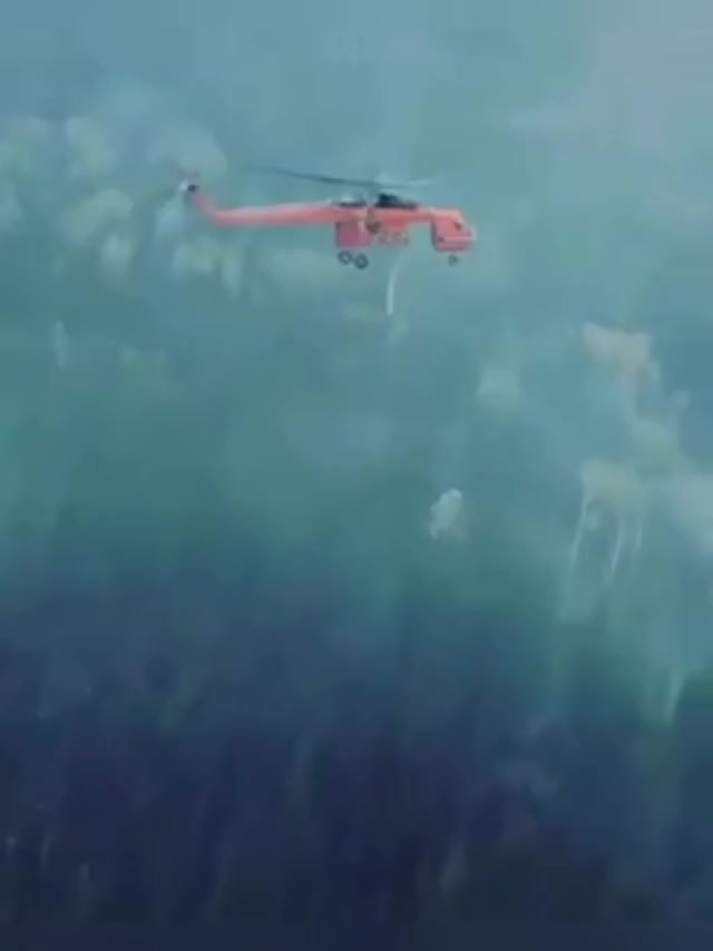 y2mate.com - erickson aircrane dropping water on a wildfire viralhog bAy mQxBn70