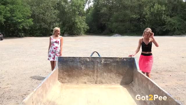 Claudia Macc and Victoria Pure relieve their pee desperation in an old skip - Watch