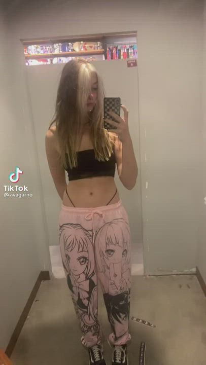 Cute blonde in anime pants leaves her thong exposed in the dressing room