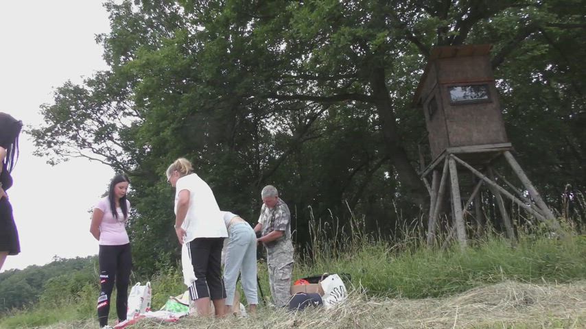 Girls play Twister outdoors but before that they try on different outfits and short