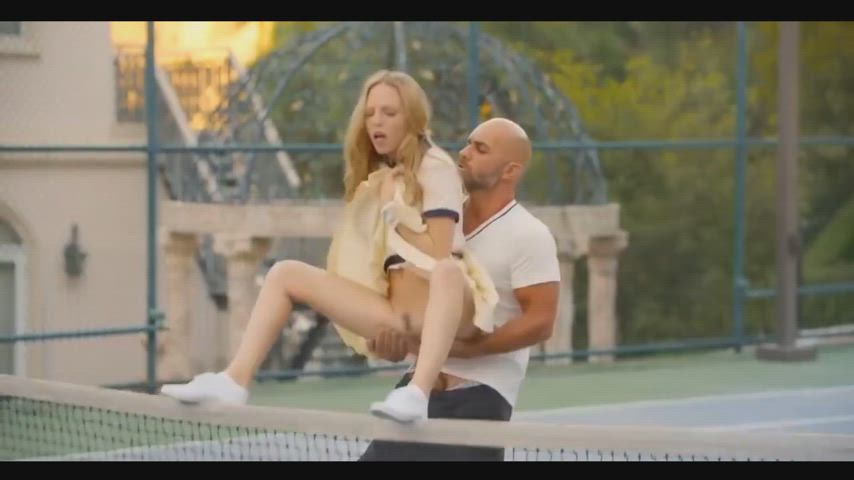 Blonde girl gets fucked on a tennis court net