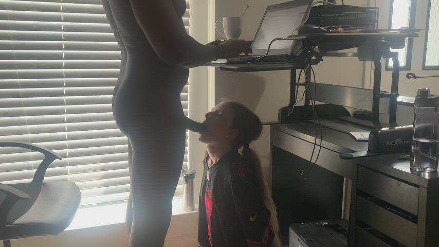 White slut sucking cock in a Kap jersey while her Dom makes money