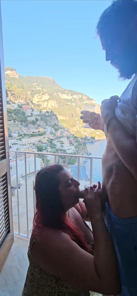 Just enjoying my wine and the beautiful views of the Amalfi coast while she worships