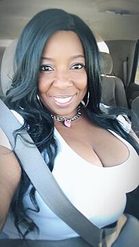 Something a bit different, Black MILF, lots of cleavage.