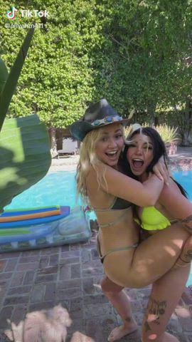 Goofy bikini girls around the pool