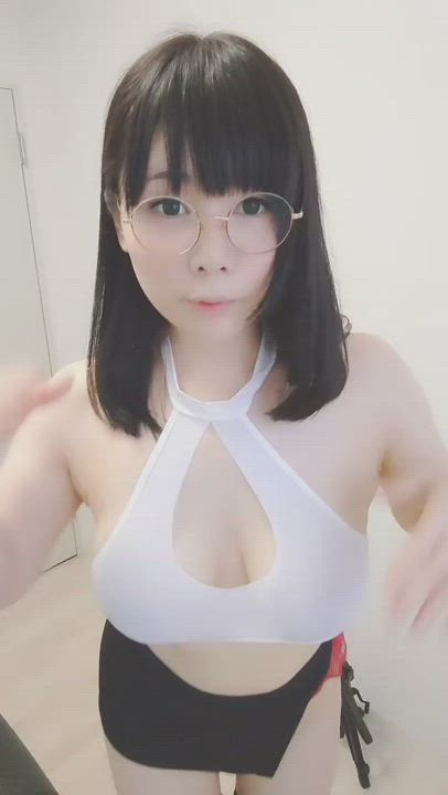 Japanese in glasses revealing her big tits