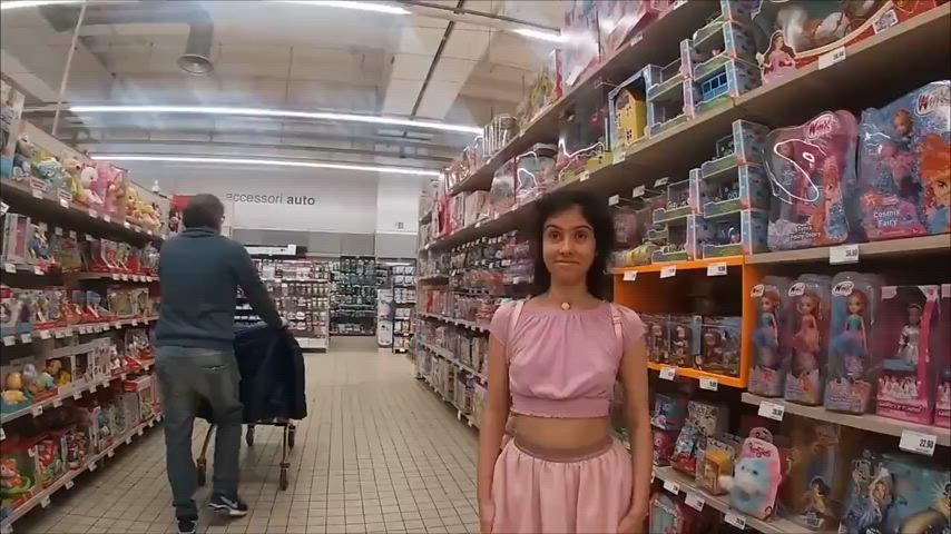 Cute pink skirt pink shirt upskirt in toy aisle in supermarket public