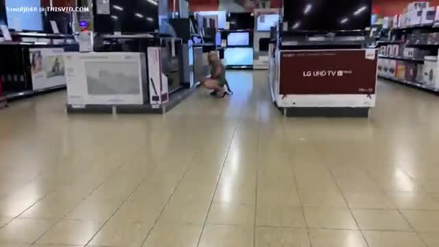 Girl pisses all over flat screen TV in store