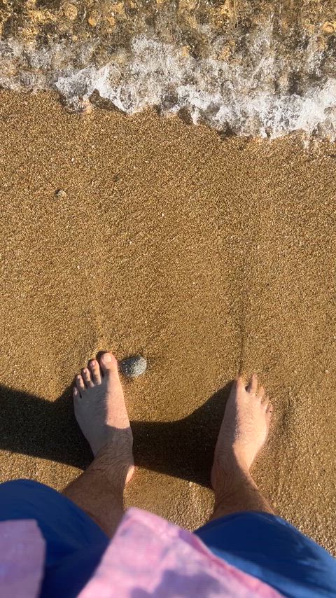 The beach water is playfully dancing around my feet, so why not join in and give