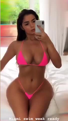 Curvy Hourglass figure Demi Rose Mawby showing off her sexy body in tight pink bikini