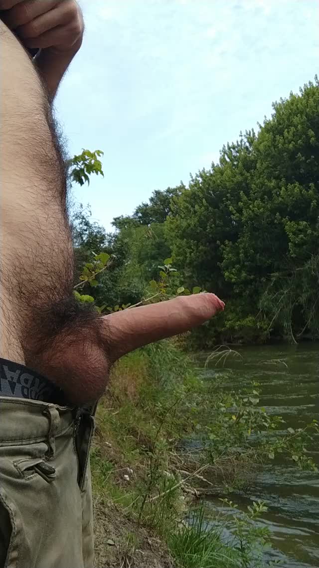 Peeing at river