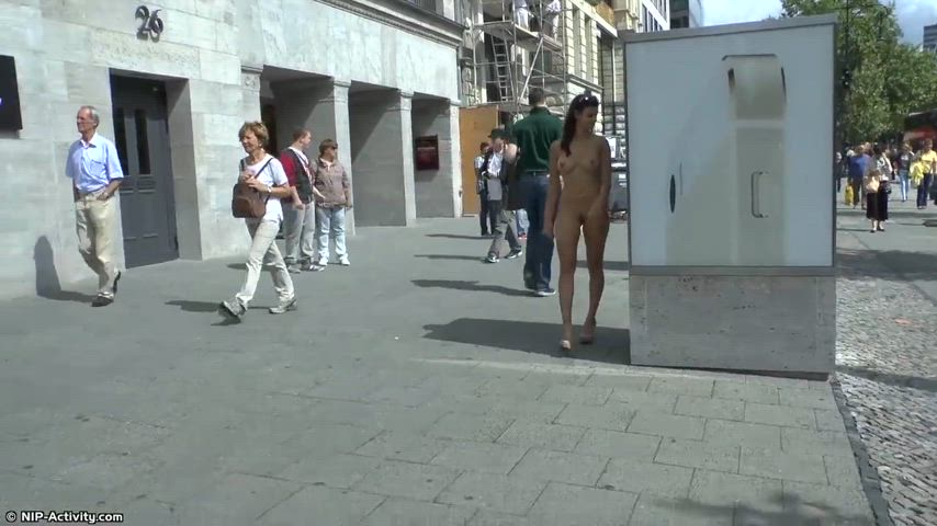 Brunette carefree public nude walking