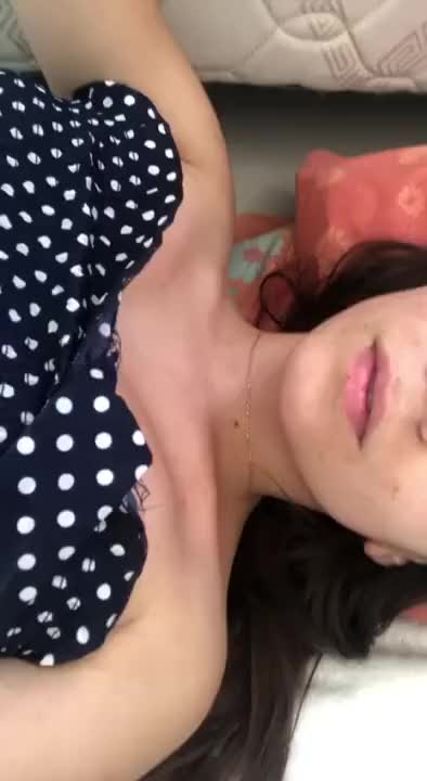Cute teen plays with her boobs