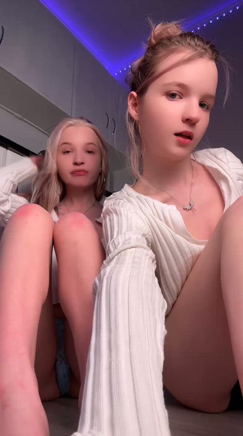 Two young girls say hello to you!