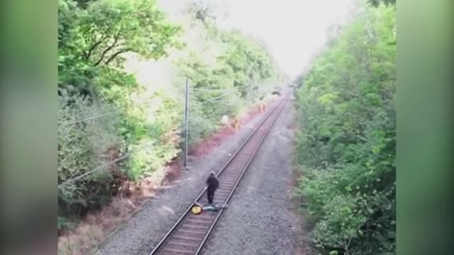 EXTRAORDINARY MOMENT HERO RAIL WORKER RISKS LIFE TO SAVE 'DRUNK' CYCLIST AS TRAIN