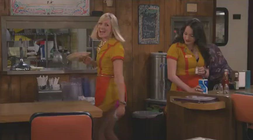 Kat Dennings checking out Beth Behrs tight little ass.