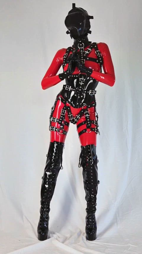 Latex catsuit, harness, and of course, corset! 