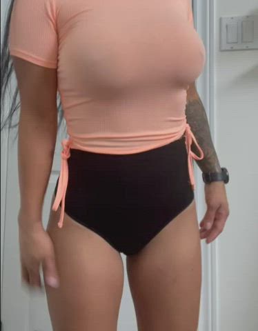 peach colored top and big tits.