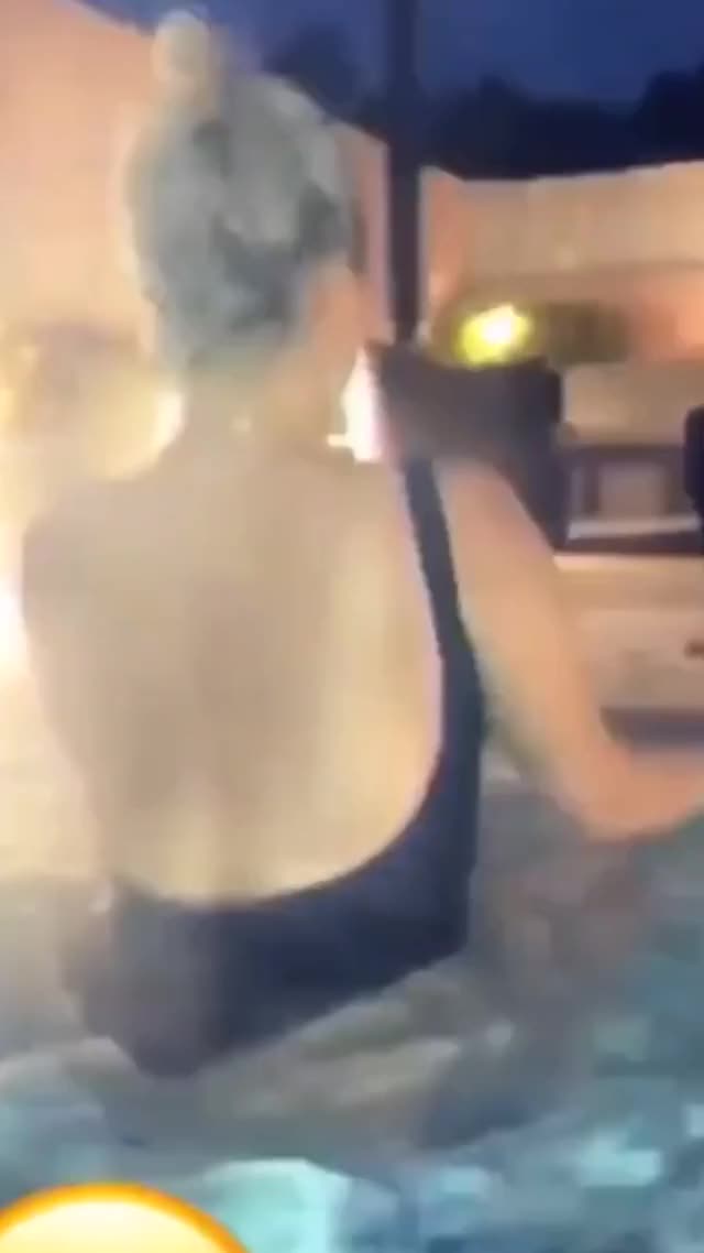 Sexy Bebe Rexha getting out of hot tub in swim suit