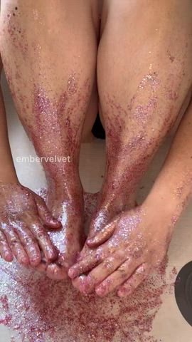 Using my hands to drag pink glitters up my thick calves