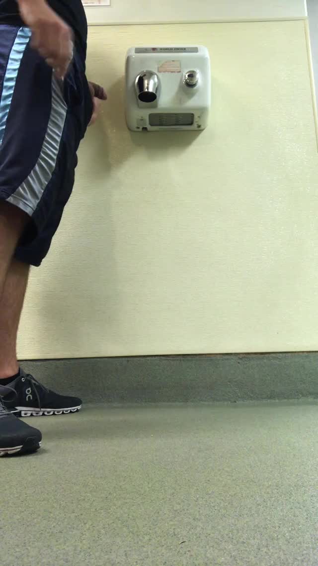 Pissing under a hand dryer