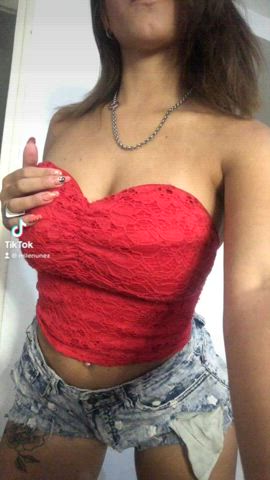 latina in a red top teasing you